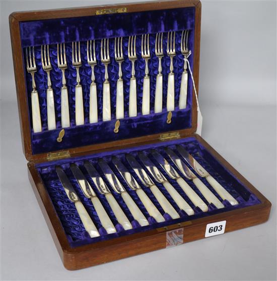 Set of silver-bladed and mother of pearl-handled fruit eaters, cased, comprising 10 knives and 12 forks